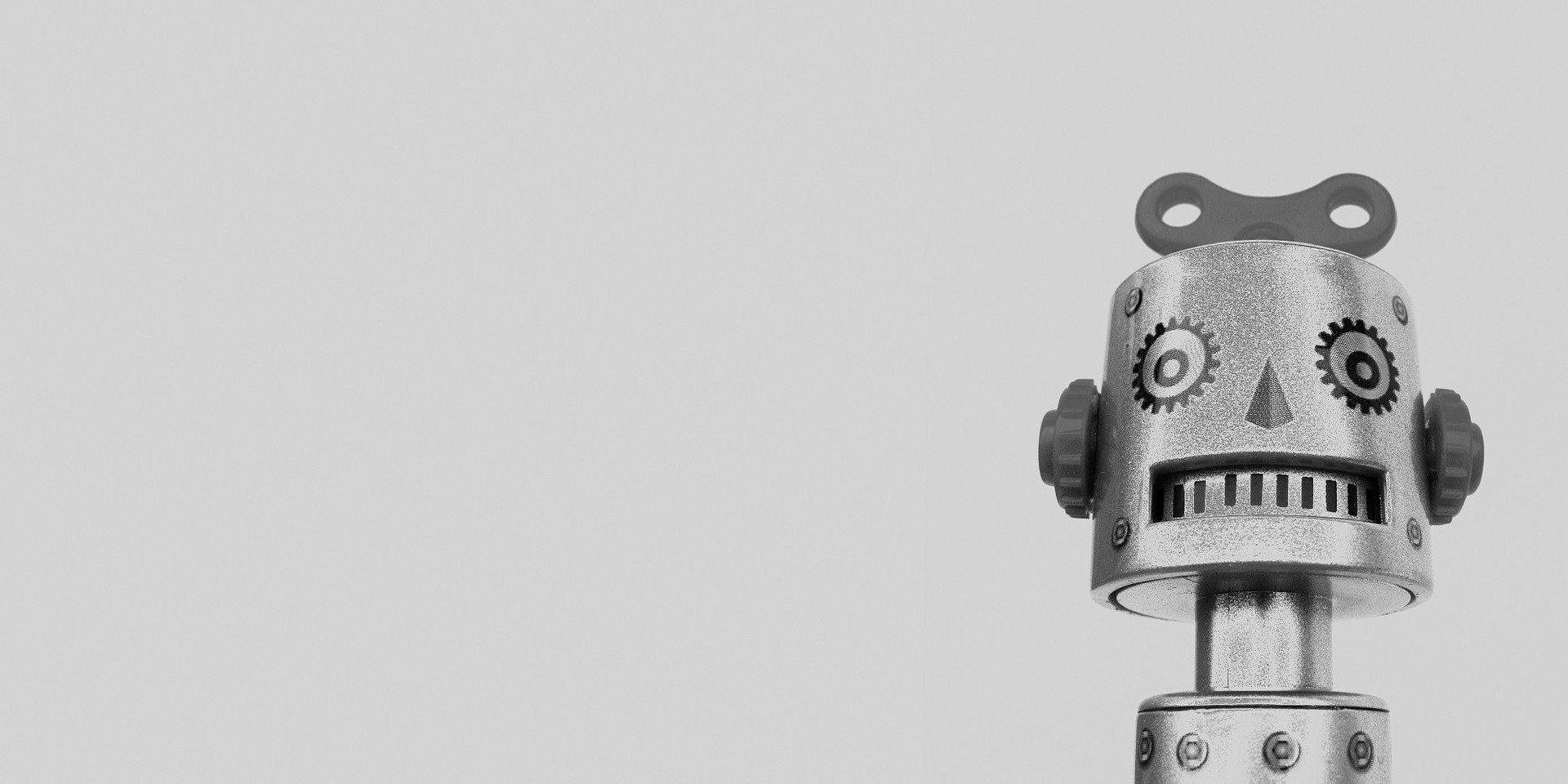 Black and white photo of a vintage tin robot toy